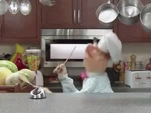 Gif of the chef from Sesame Street drumming on melons in the kitchen with wooden spoons.