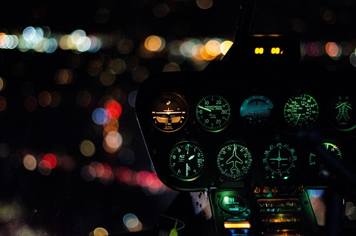 An image of a helicopter dashboard at night.