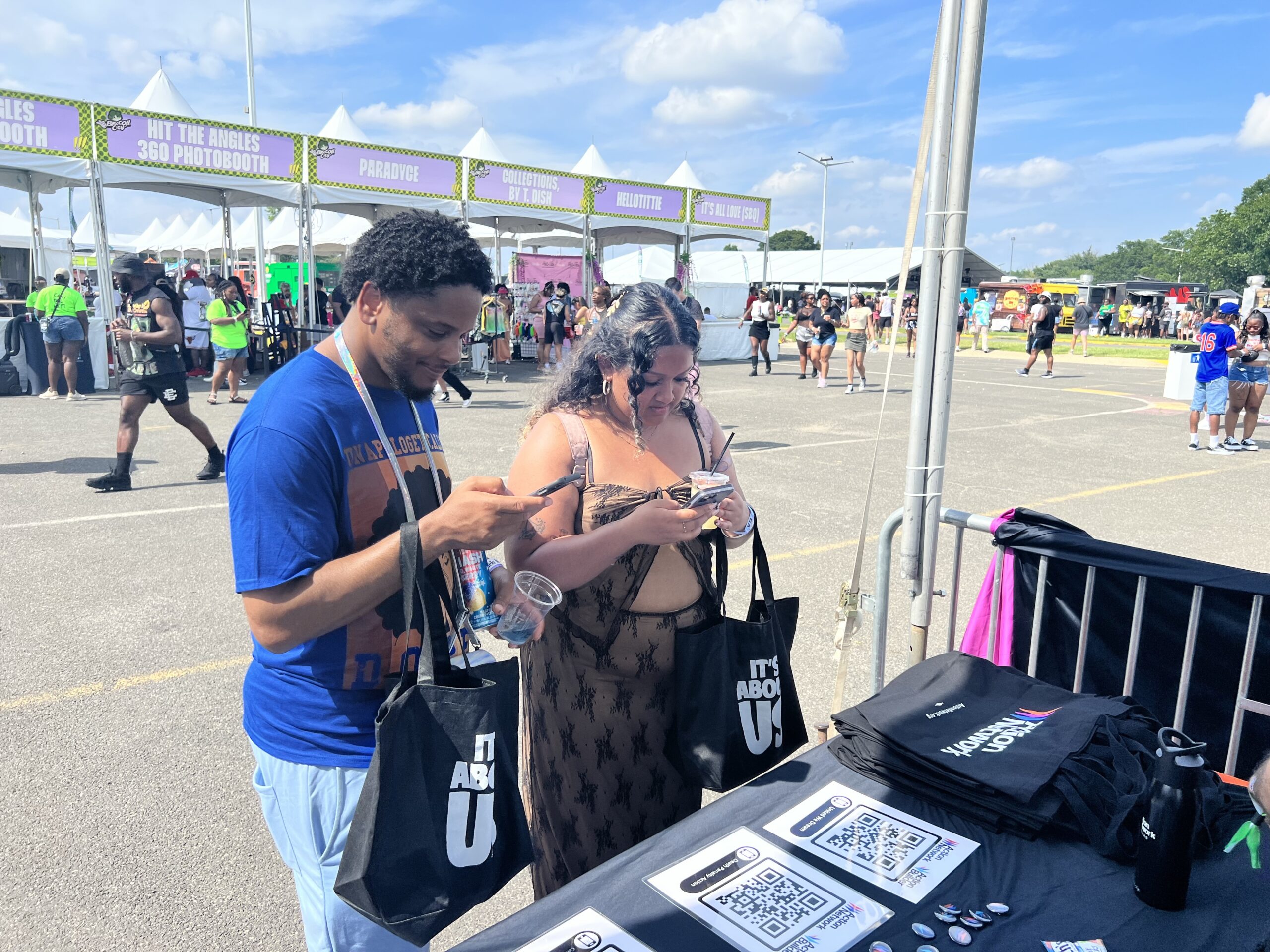 Broccoli City Festival attendees visiting the Action Network booth.